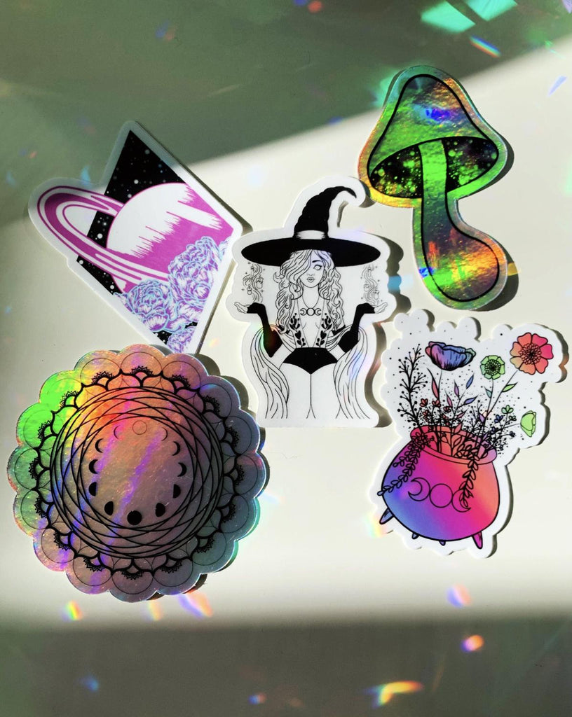 In this discounted sticker pack you get all five of these mystical, magical stickers! two of them are holographic, one is black and white with a transparent background and the other two are super colorful. They all carry the energy of Love Light self-expression freedom and peace that comes from connection with the divine sacred Universe.