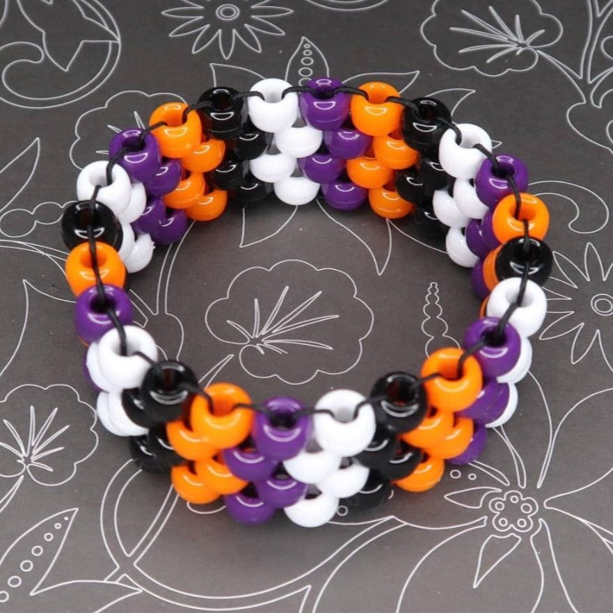 halloweentown inspired spooky stripe kandi cuff perfect for insomniac's escape halloween festival witching hour sorcerer magical vibes