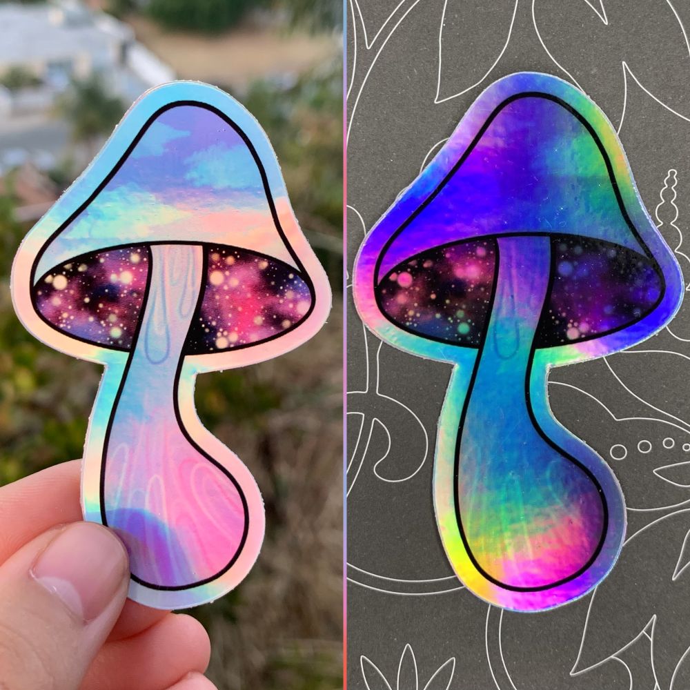 Do you need some trippy art for your room? Ever wondered where you can buy trippy art or have some custom-made for yourself or your homies? Well you’ve come to the right place! The Shroom-scend Holographic Sticker at Tori Arnold Art features a sunset sky design on the mushroom cap with a psychedelic galaxy under the cap. The stem of the mushroom has an abstract curvy lines design.